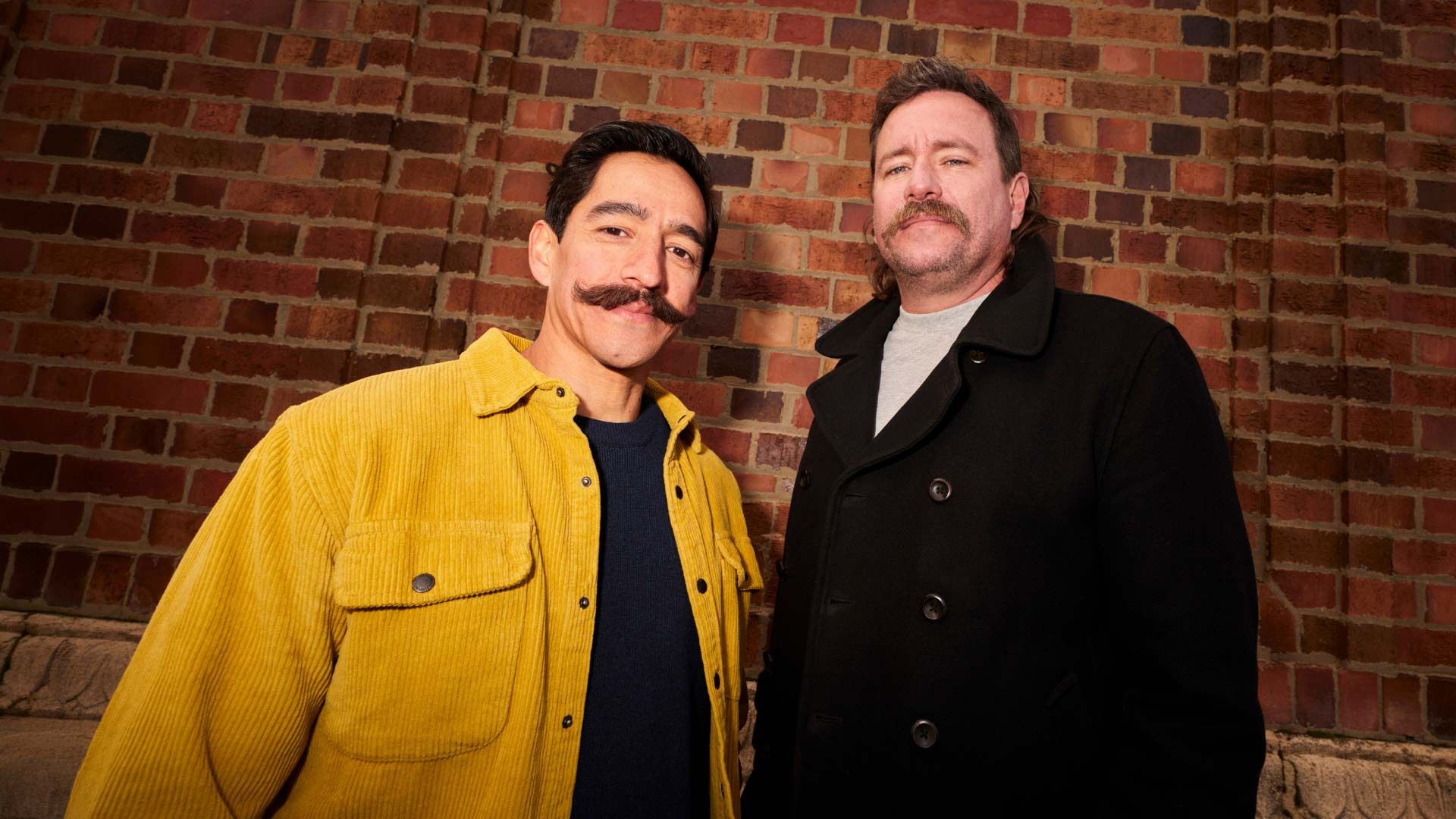 Photo of a man twirling his excellent moustache.